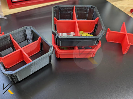 Set of red and gray storage bins on a dark surface