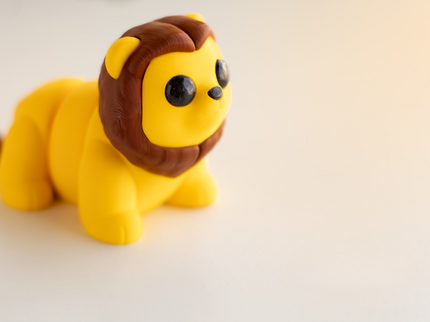 Toy lion figure on a light background