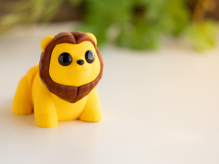 Toy lion figure on a light background