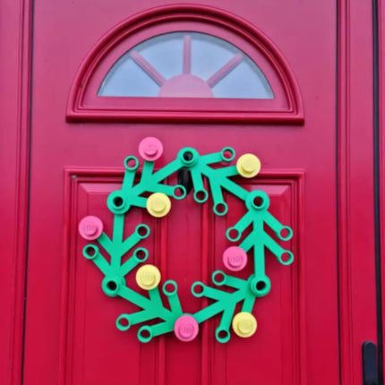 Colorful wreath decoration on a red door