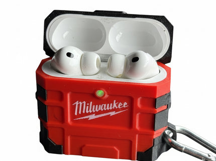 White wireless earbuds in a red Milwaukee case on a stark white background