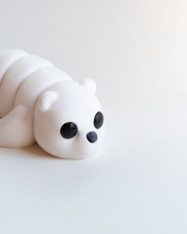 White bear figurine on a light gray background