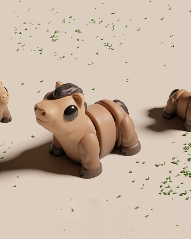 Three toy horses on a beige surface with scattered green leaves.