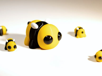 Toy bee figures on a white background