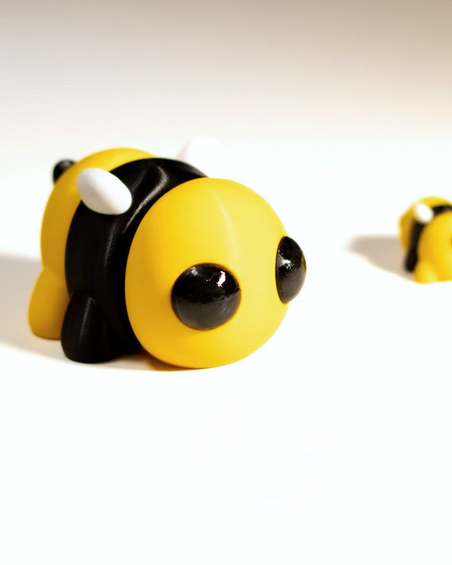 Toy bee figures on a white background