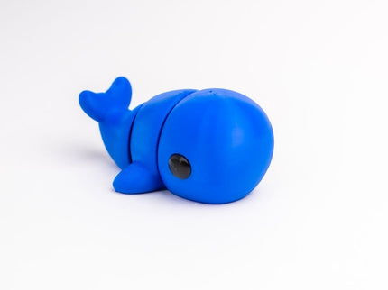 Blue whale-shaped object on a white background