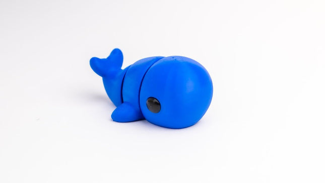 Blue whale-shaped object on a white background