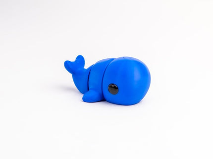 Blue whale toy on a white background