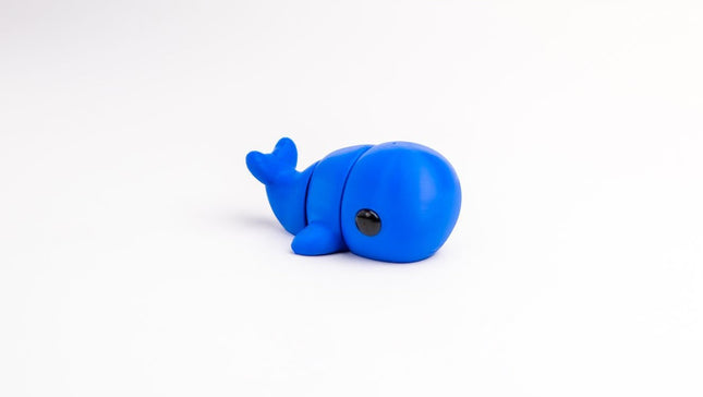 Blue whale toy on a white background