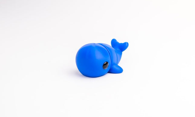 Blue whale toy on a white background